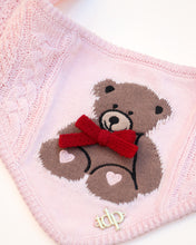 Load image into Gallery viewer, Pink knitted dog bandana with a teddy bear design and red bow on a white background