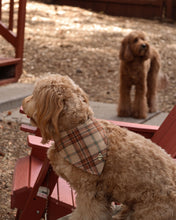 Load image into Gallery viewer, Plaid dog bandana in warm camel, brown, cream, and rust tones with a classic heritage-inspired pattern.
