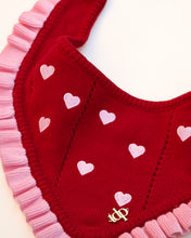 Load image into Gallery viewer, Red dog bandana with pink hearts and a logo on a white background
