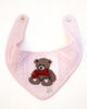 Pink dog bandana with teddy bear design on a white background