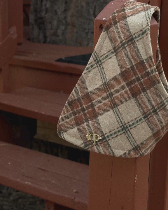 A timeless plaid in warm camel, brown, cream, and rust with a subtle touch of warm blue.