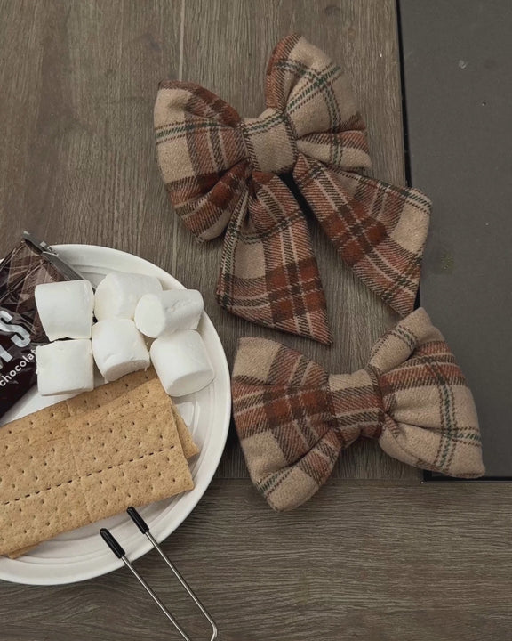 Plaid dog sailor bow in warm camel, brown, cream, and rust tones with a classic heritage-inspired design.